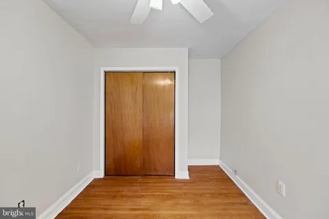 a view of hallway with wooden floor