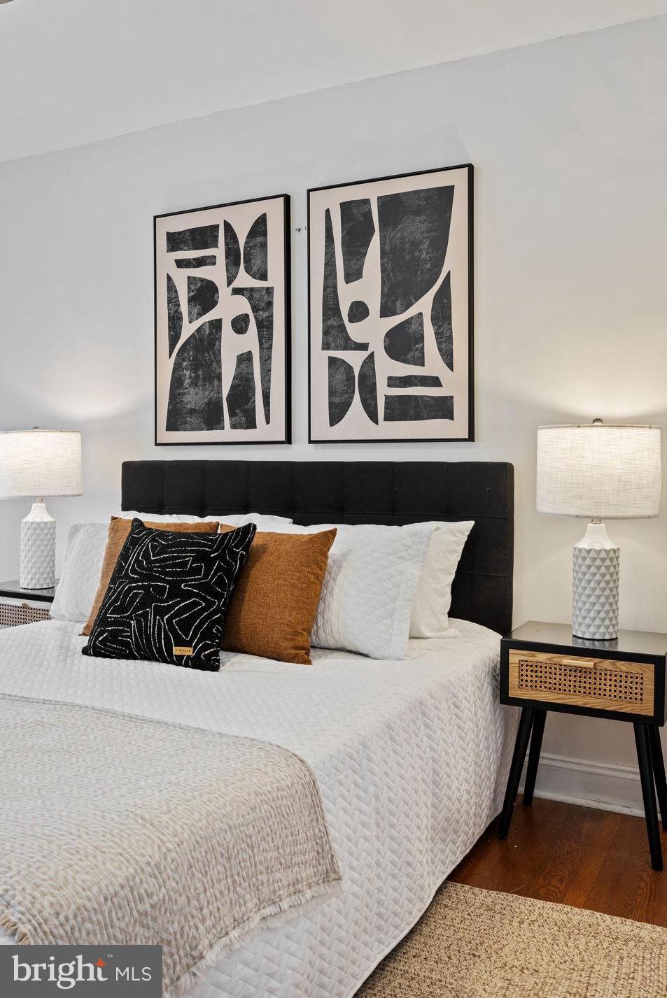 3138 Miller Street Philadelphia, PA 19134 - Photo 22 of 30 a large bed sitting in a bedroom next to a lamp