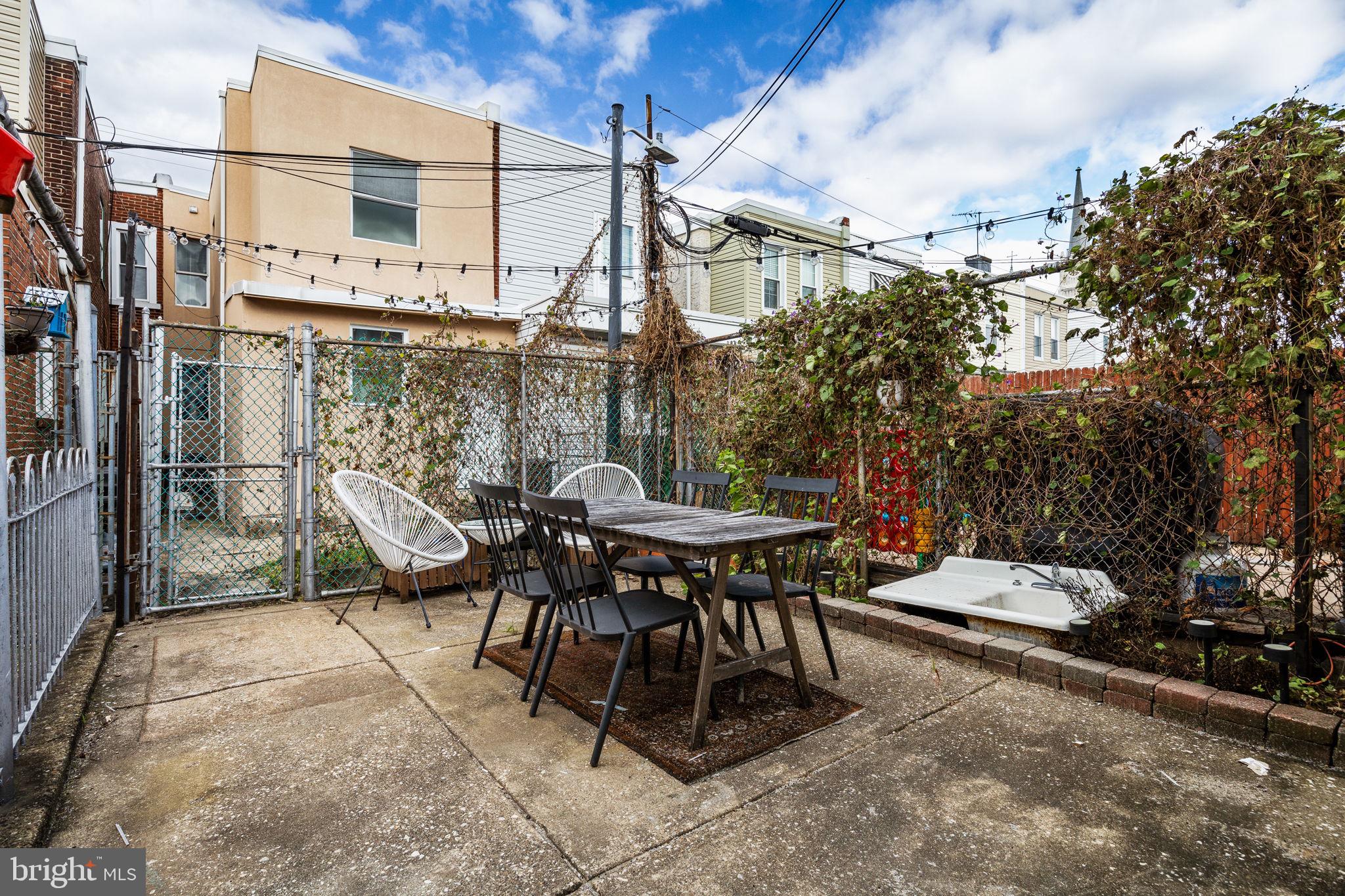 3138 Miller Street Philadelphia, PA 19134 - Photo 27 of 30 a view of a patio with a table and chairs