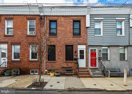 a front view of a building with glass windows