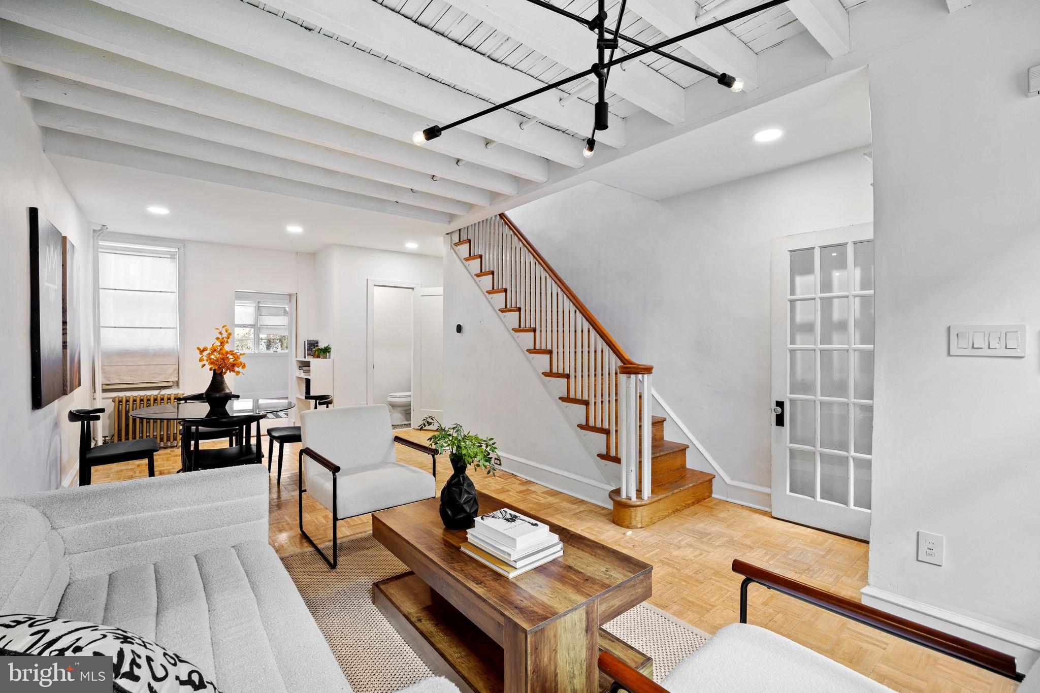3138 Miller Street Philadelphia, PA 19134 - Photo 6 of 30 a living room with furniture dining table and a flat screen tv