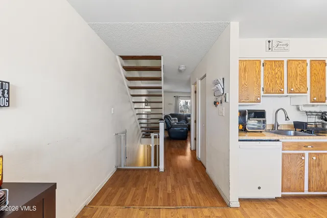 a kitchen with stainless steel appliances a refrigerator and a stove top oven