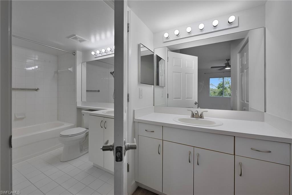 1885 Florida Club Drive, Unit 8305 Naples, FL 34112 - Photo 12 of 22 Bathroom featuring vanity, light tile patterned floors