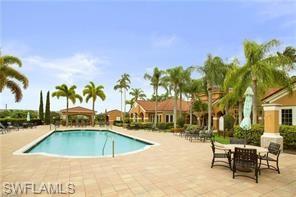 1885 Florida Club Drive, Unit 8305 Naples, FL 34112 - Photo 20 of 22 Community pool featuring a patio area