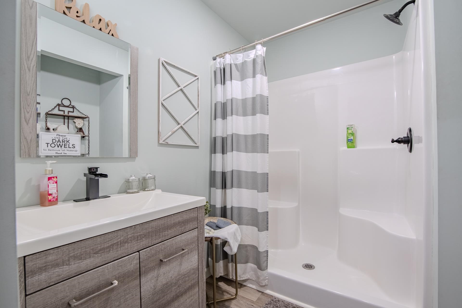 25 Bogey Loop Counce, TN 38326 - Photo 34 of 37 Bathroom with vanity, a stall shower, and light wood-style flooring