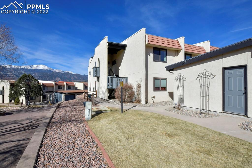 1142 Fontmore Road, Unit C Colorado Springs, CO 80904 - Photo 1 of 33 a front view of a house with a yard