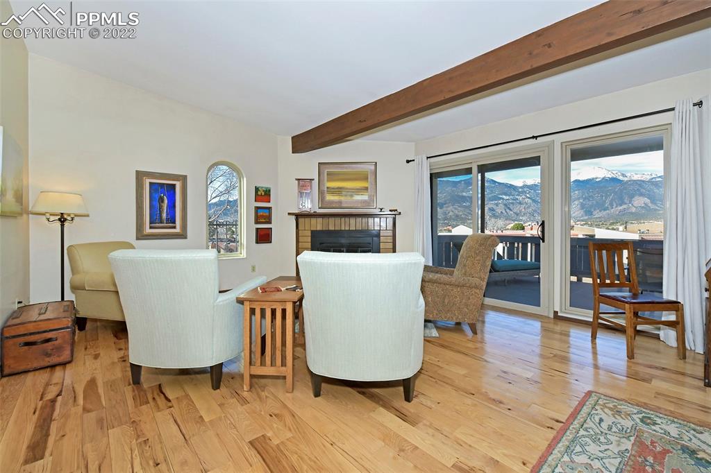 1142 Fontmore Road, Unit C Colorado Springs, CO 80904 - Photo 2 of 33 a living room with furniture and a wooden floor