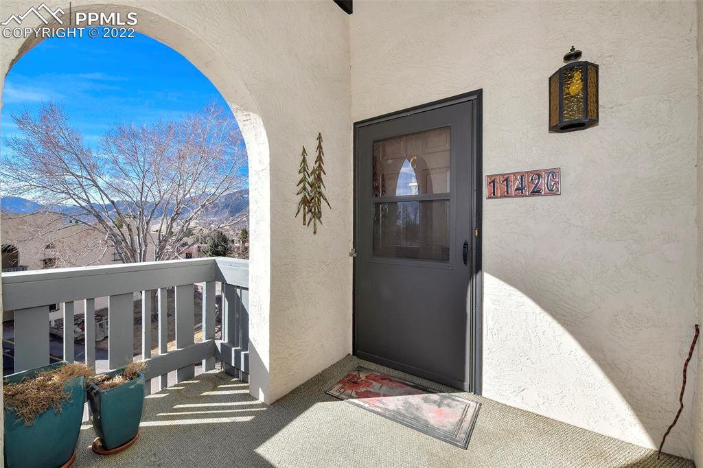1142 Fontmore Road, Unit C Colorado Springs, CO 80904 - Photo 24 of 33 a view of a porch with wooden floor