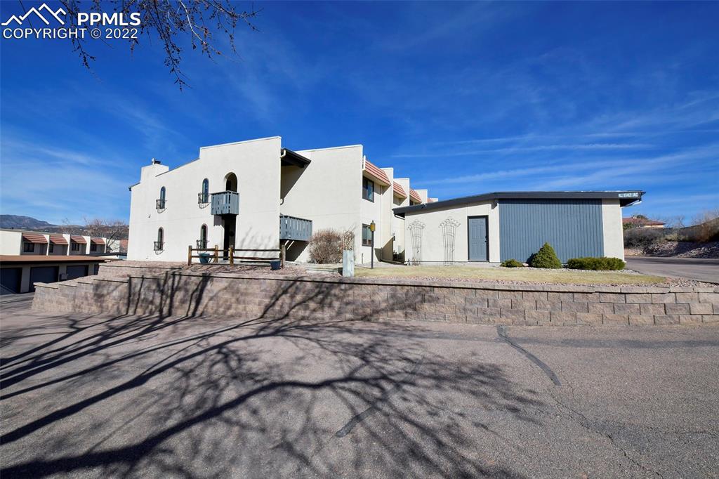 1142 Fontmore Road, Unit C Colorado Springs, CO 80904 - Photo 27 of 33 a view of a house with a yard
