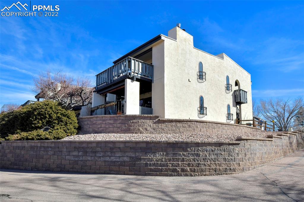 1142 Fontmore Road, Unit C Colorado Springs, CO 80904 - Photo 28 of 33 a view of house with a yard and sitting area