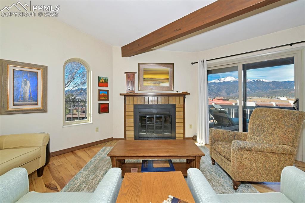 1142 Fontmore Road, Unit C Colorado Springs, CO 80904 - Photo 7 of 33 a living room with furniture and a fireplace