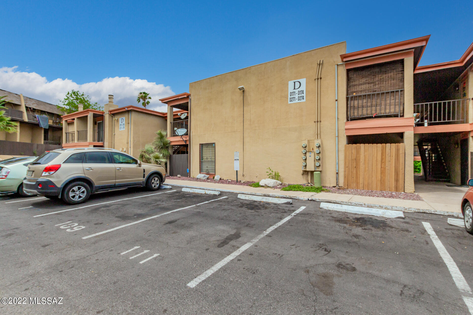 1620 North Wilmot Road, Unit D273 Tucson, AZ 85712 - Photo 14 of 15 a car parked in front of a building