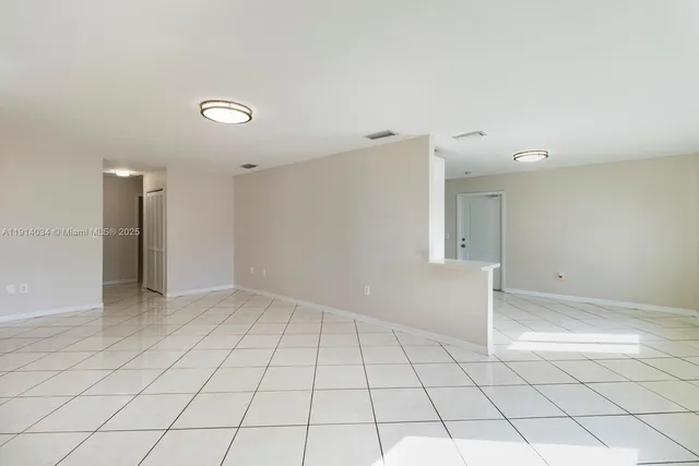 a view of an empty room and window