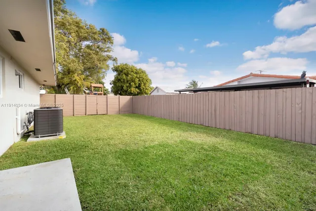 a view of backyard with green space