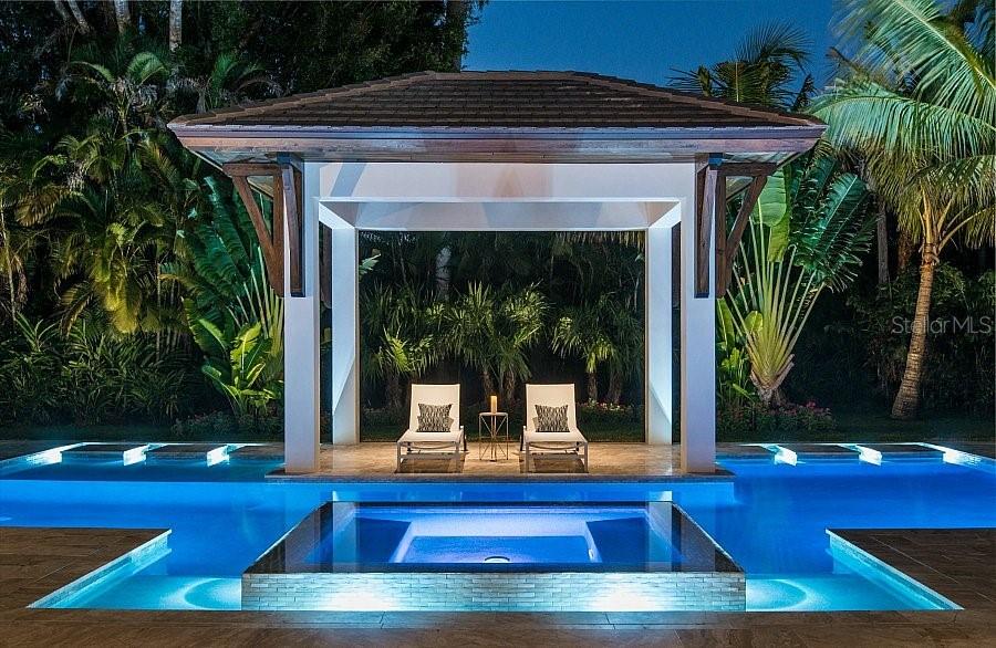 5215 Hidden Harbor Road Sarasota, FL 34242 - Photo 11 of 22 a view of sitting area in front of house with palm trees