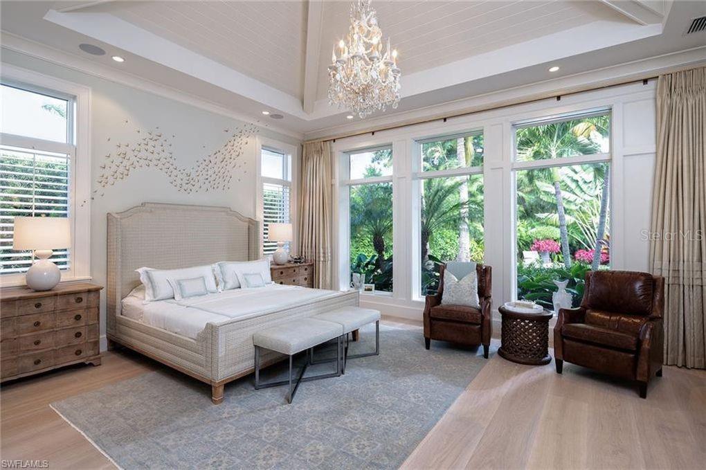 5215 Hidden Harbor Road Sarasota, FL 34242 - Photo 4 of 22 a bedroom with a bed and a couch