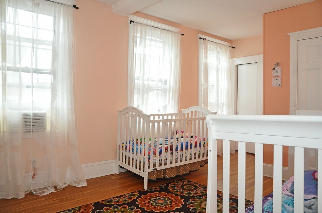 30 Kinross Road, Unit 12 Boston, MA 02135 - Photo 8 of 11 a view of entryway with wooden floor