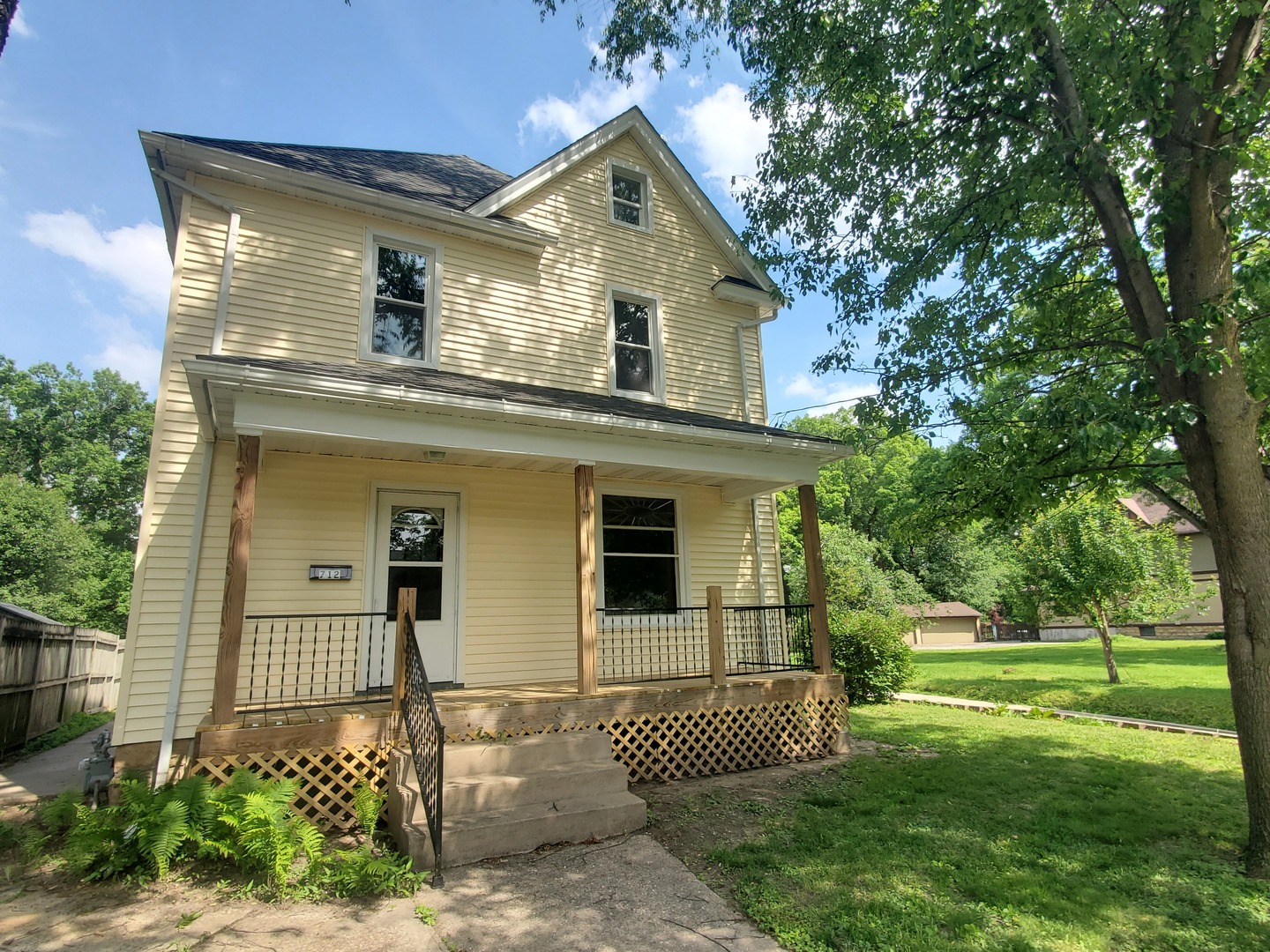 712 3rd Street Moline, IL 61265 - Photo 1 of 29 a front view of a house with a yard