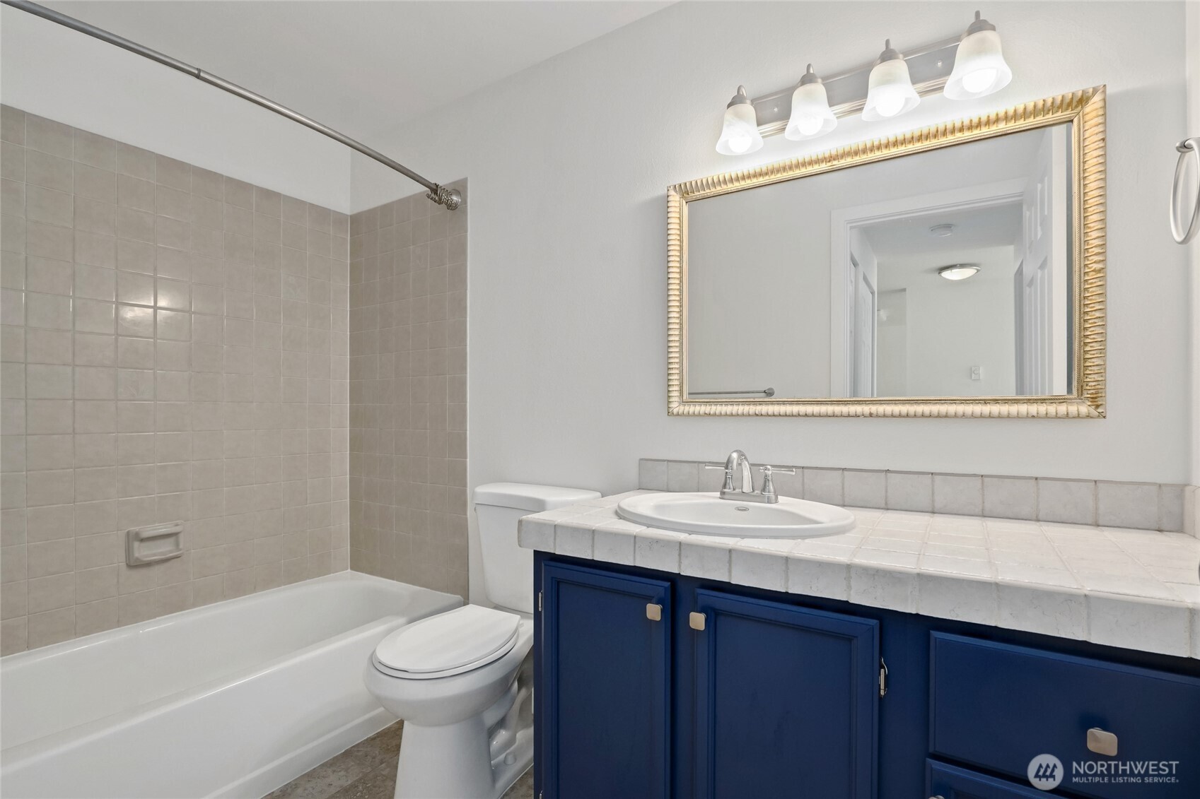 10501 8th Avenue Northeast, Unit 334 Seattle, WA 98125 - Photo 14 of 22 a bathroom with a sink and a mirror