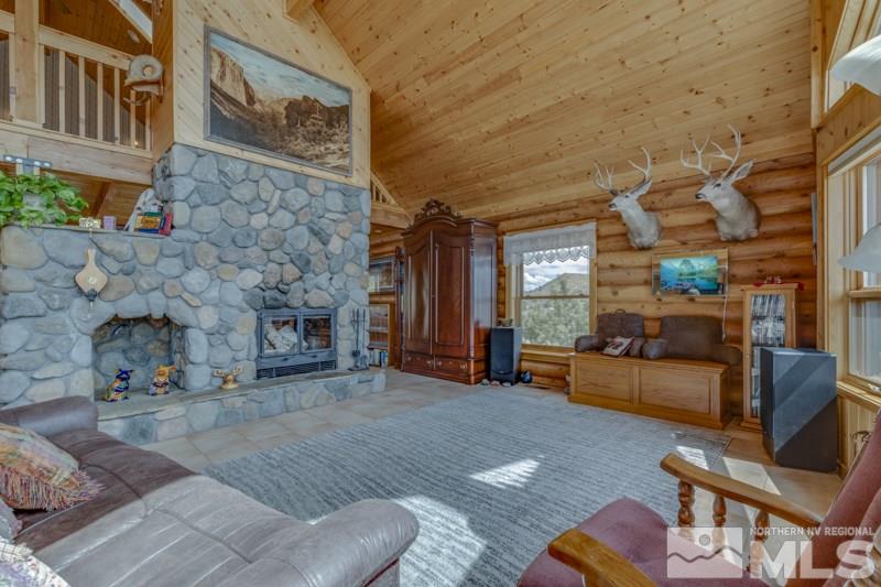 650 Curnow Canyon Road Reno, NV 89510 - Photo 19 of 40 a living room with furniture and a fireplace