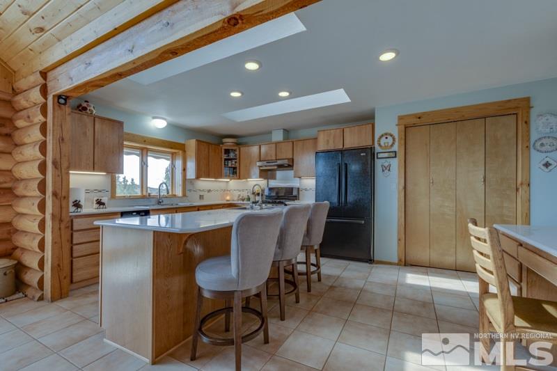 650 Curnow Canyon Road Reno, NV 89510 - Photo 24 of 40 a large kitchen with a table and chairs
