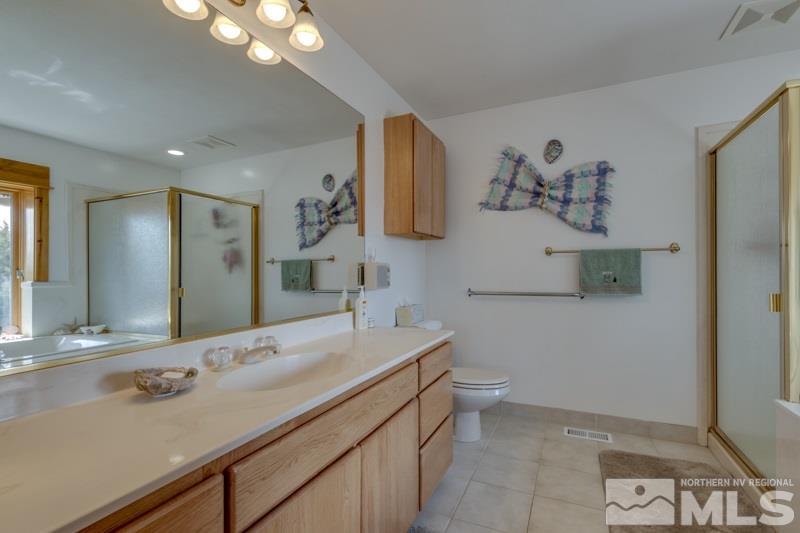 650 Curnow Canyon Road Reno, NV 89510 - Photo 28 of 40 a bathroom with a sink and a mirror