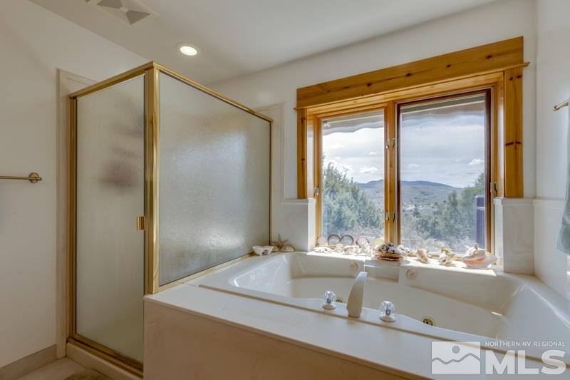 650 Curnow Canyon Road Reno, NV 89510 - Photo 29 of 40 a bathroom with a tub and a sink