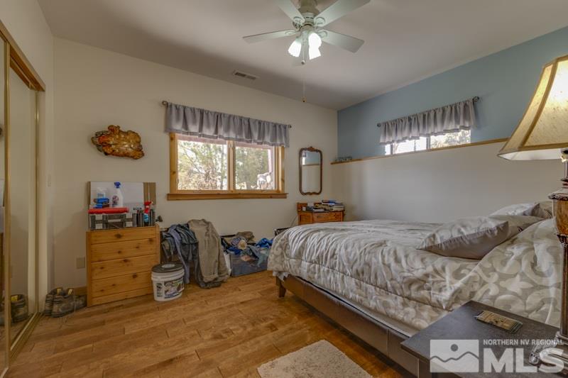 650 Curnow Canyon Road Reno, NV 89510 - Photo 35 of 40 a bedroom with a bed and a chandelier