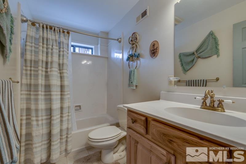 650 Curnow Canyon Road Reno, NV 89510 - Photo 36 of 40 a bathroom with a sink a toilet and shower