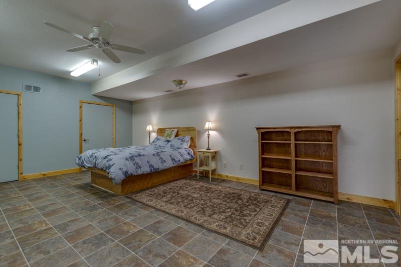 650 Curnow Canyon Road Reno, NV 89510 - Photo 37 of 40 a bedroom with a bed and a cabinets