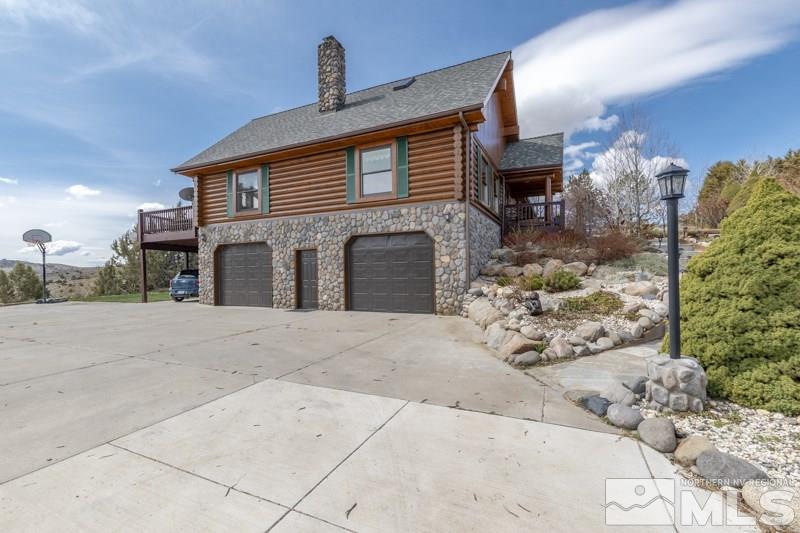 650 Curnow Canyon Road Reno, NV 89510 - Photo 10 of 40 a front view of a house with a yard and garage