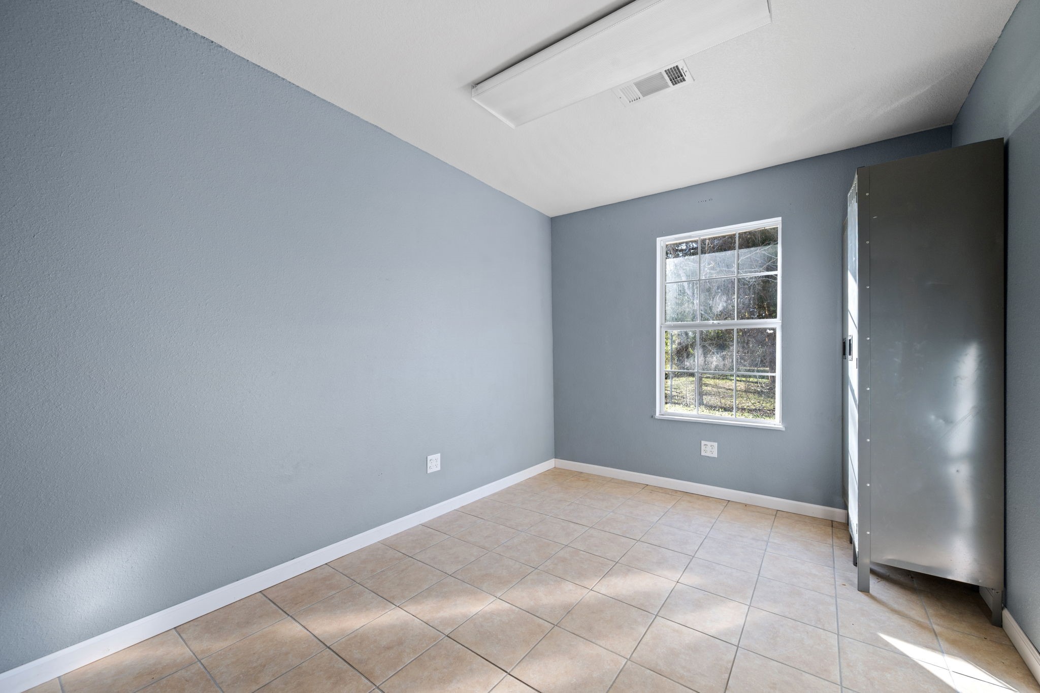 114 Main Street Hull, TX 77564 - Photo 14 of 25 a view of an empty room with a window