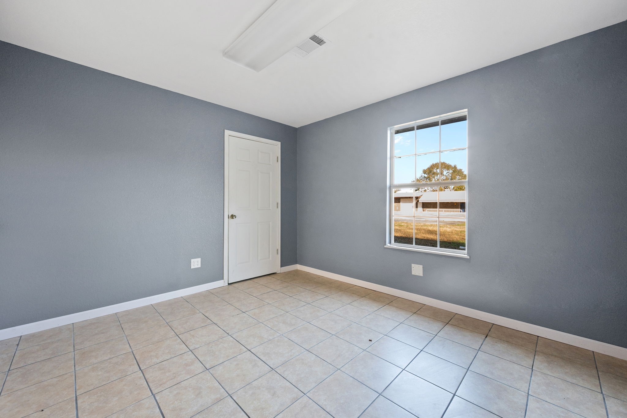 114 Main Street Hull, TX 77564 - Photo 17 of 25 a view of an empty room with a window