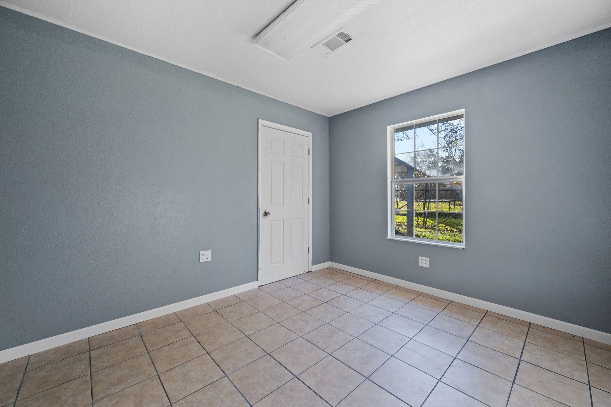 114 Main Street Hull, TX 77564 - Photo 18 of 25 a view of an empty room and window