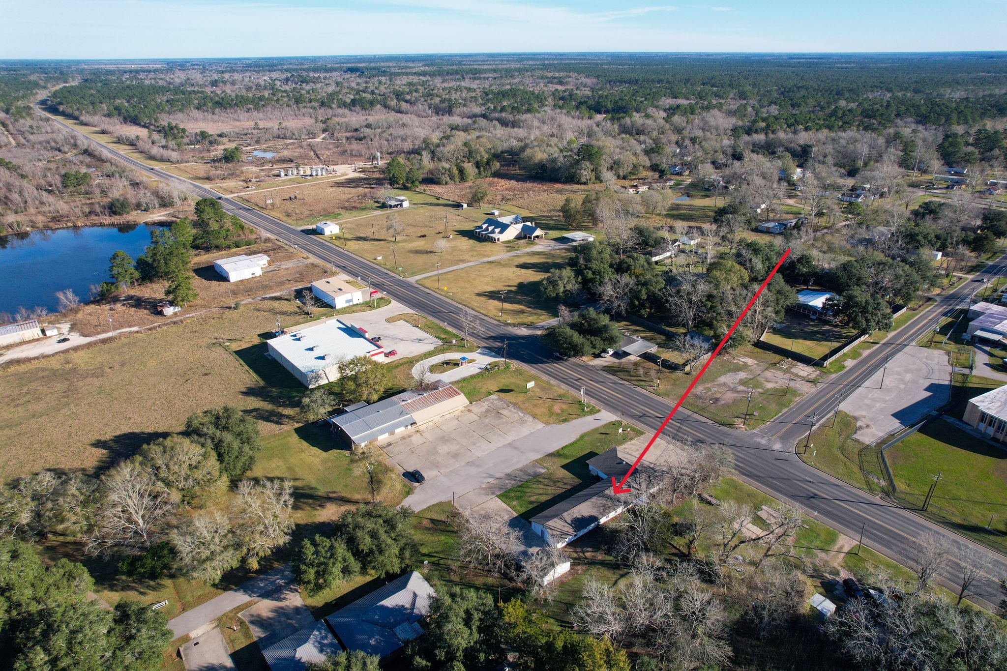 114 Main Street Hull, TX 77564 - Photo 23 of 25 an aerial view of a house with a yard