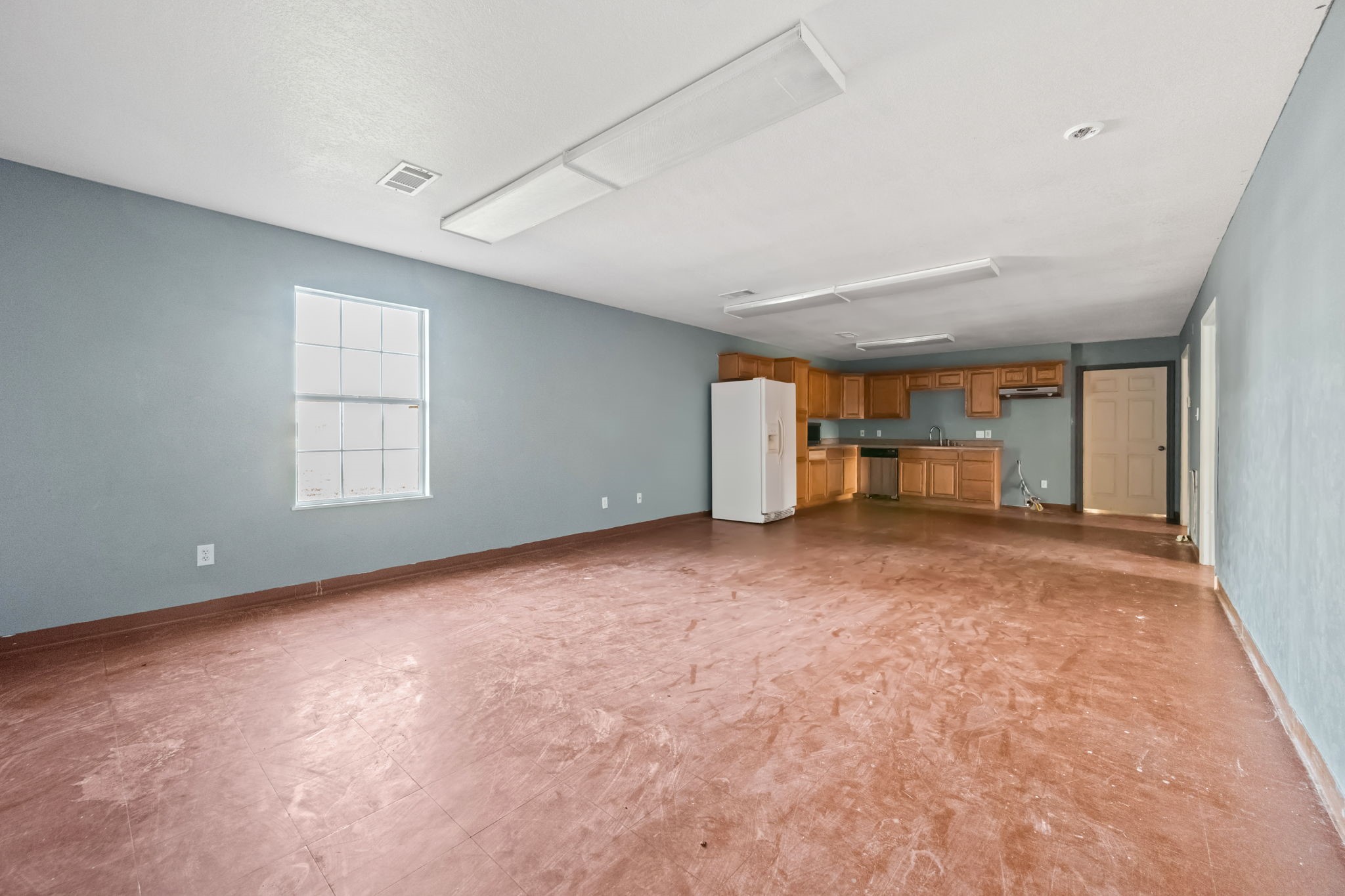 114 Main Street Hull, TX 77564 - Photo 5 of 25 a view of an empty room with a window