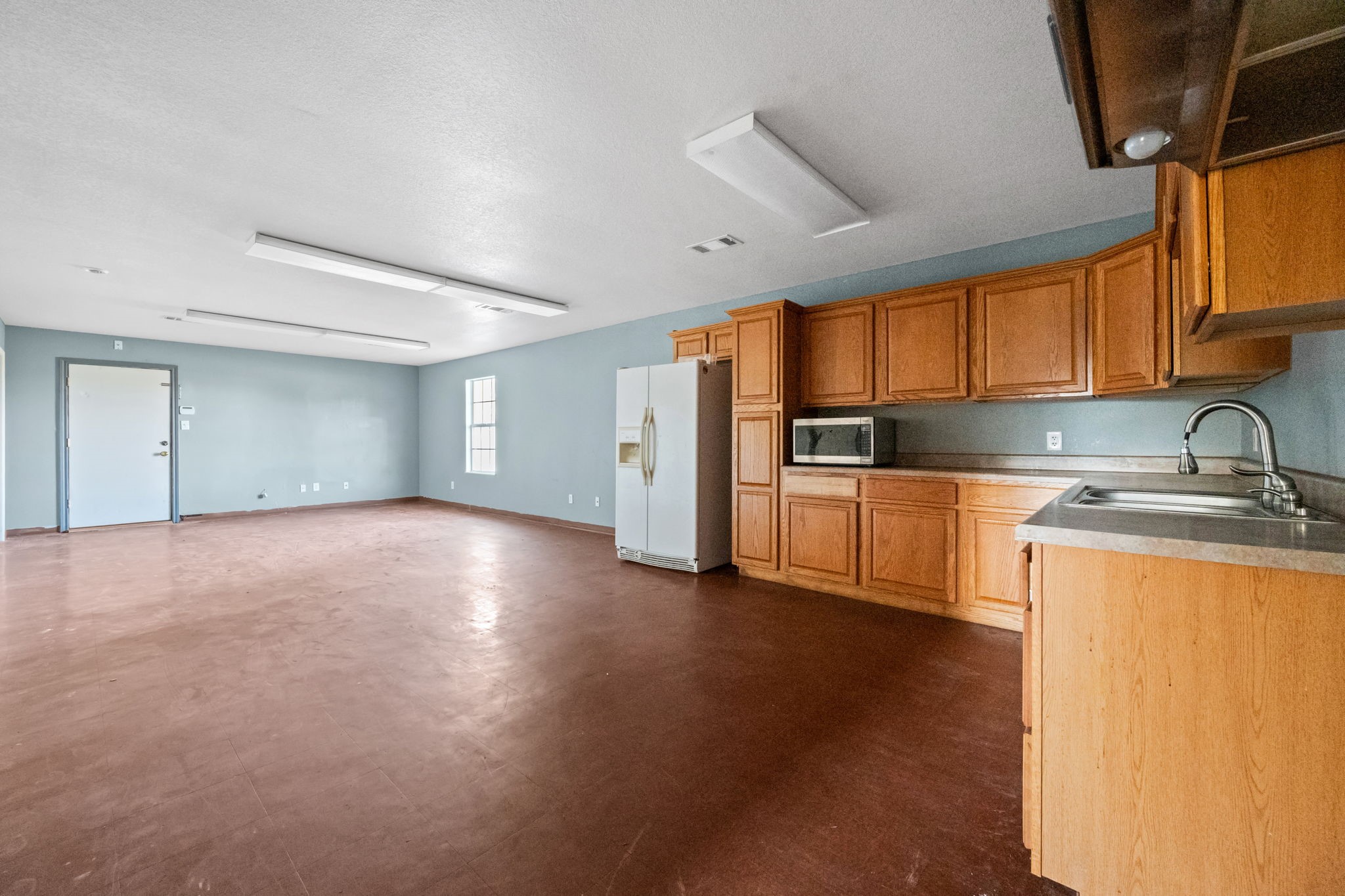 114 Main Street Hull, TX 77564 - Photo 10 of 25 a view of a kitchen with a sink and cabinets