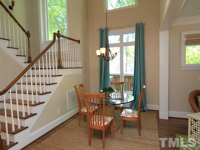 619 Mills Street Raleigh, NC 27608 - Photo 13 of 25 a view of a dining room with furniture window and wooden floor