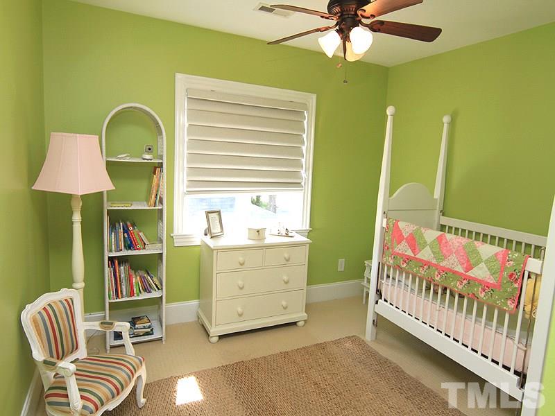 619 Mills Street Raleigh, NC 27608 - Photo 20 of 25 a bedroom with furniture and a window