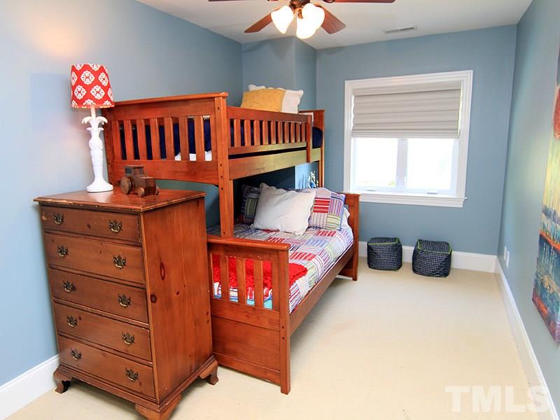 619 Mills Street Raleigh, NC 27608 - Photo 21 of 25 a bedroom with furniture and a window