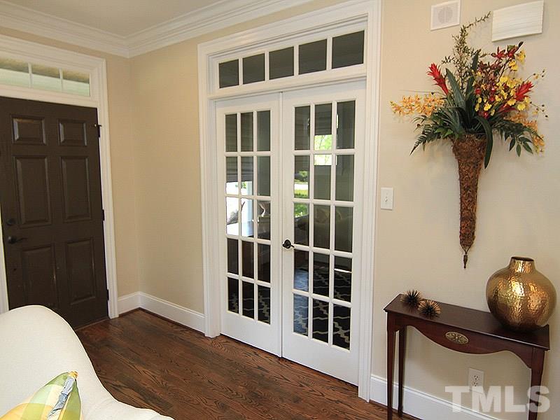 619 Mills Street Raleigh, NC 27608 - Photo 6 of 25 a view of a livingroom with wooden floor and a potted plant