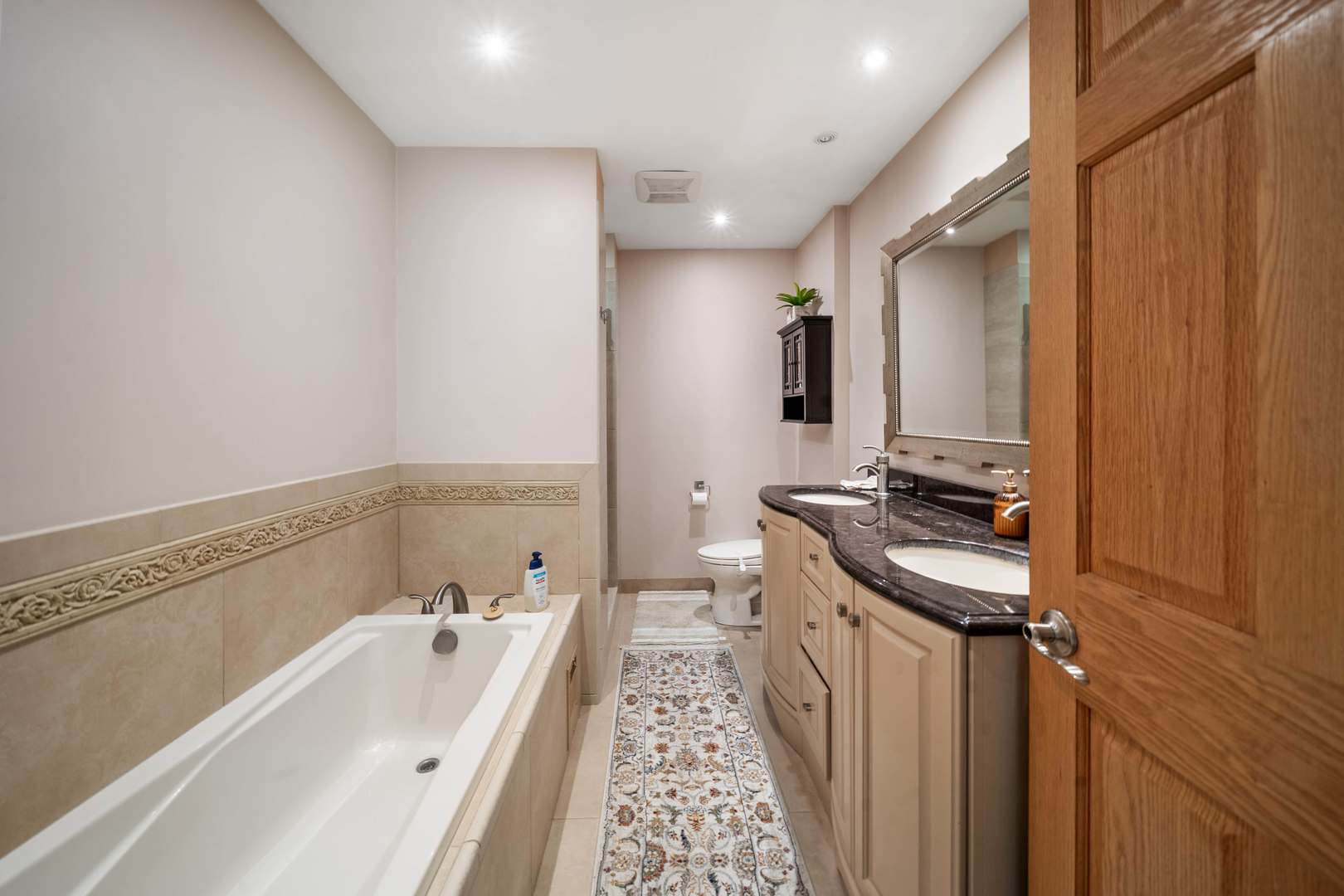5N750 Medinah Road Medinah, IL 60157 - Photo 20 of 53 a bathroom with a sink a mirror and a bathtub