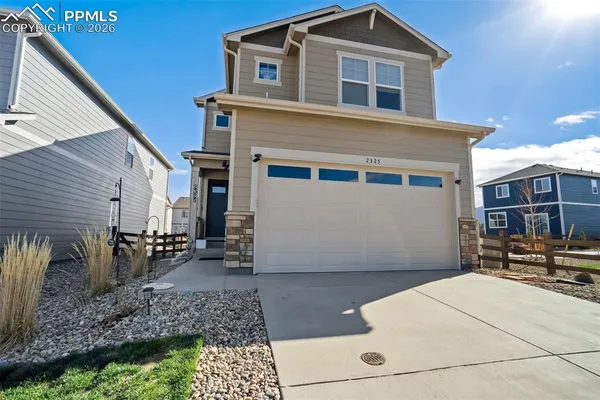 a front view of a house with yard