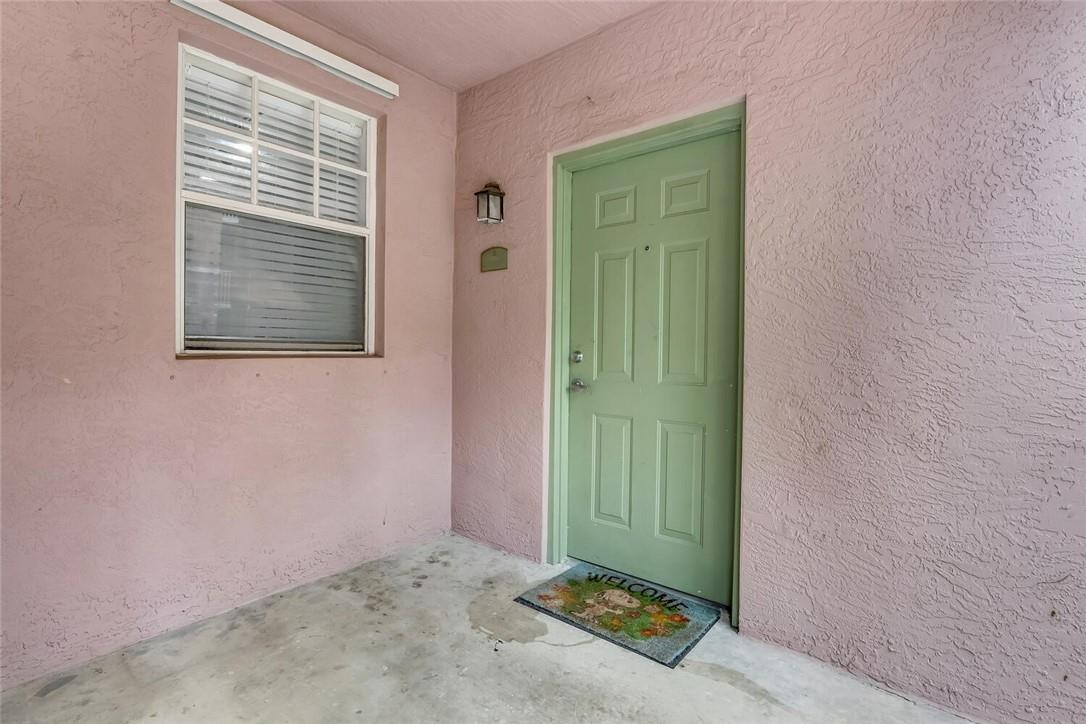 6882 West Sample Road, Unit 6882 Pompano Beach, FL 33063 - Photo 2 of 26 an empty room with window and closet