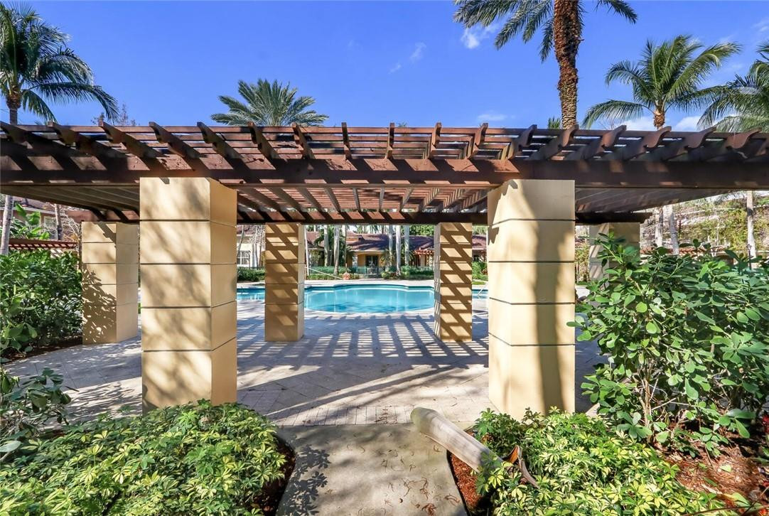 6882 West Sample Road, Unit 6882 Pompano Beach, FL 33063 - Photo 23 of 26 a backyard of a house with lots of green space