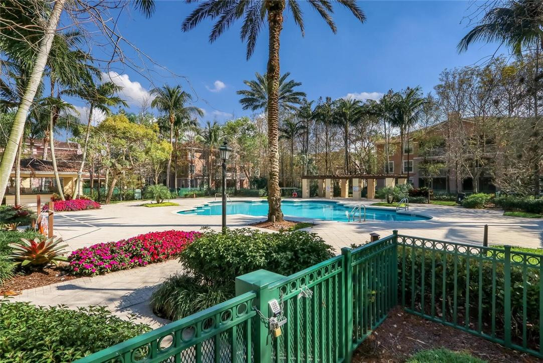 6882 West Sample Road, Unit 6882 Pompano Beach, FL 33063 - Photo 25 of 26 a view of a park with iron fence