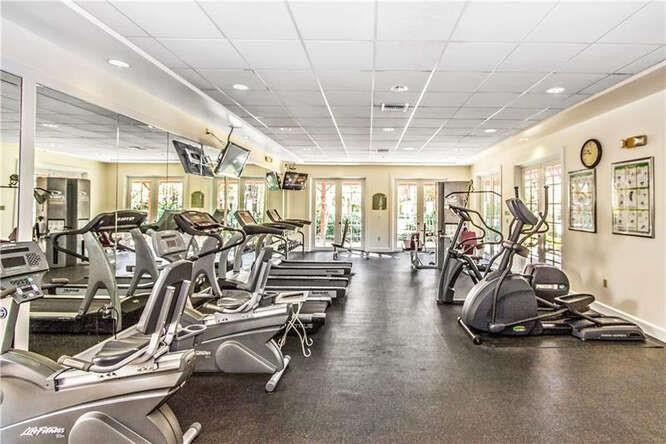 6882 West Sample Road, Unit 6882 Pompano Beach, FL 33063 - Photo 26 of 26 a view of a room with gym equipment