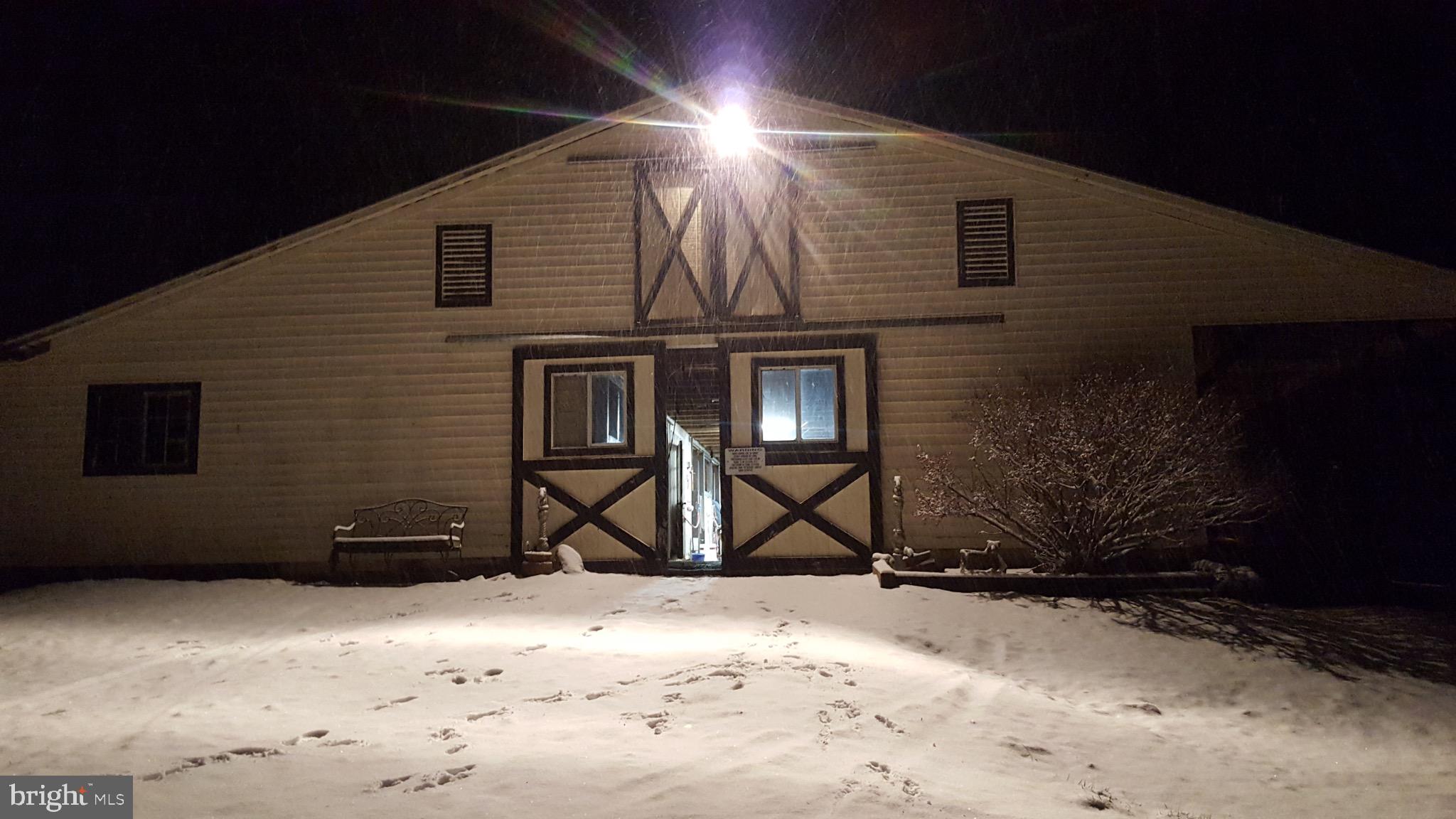 19255 Telegraph Springs Road Purcellville, VA 20132 - Photo 13 of 20 Snowy night at a charming barn entrance.