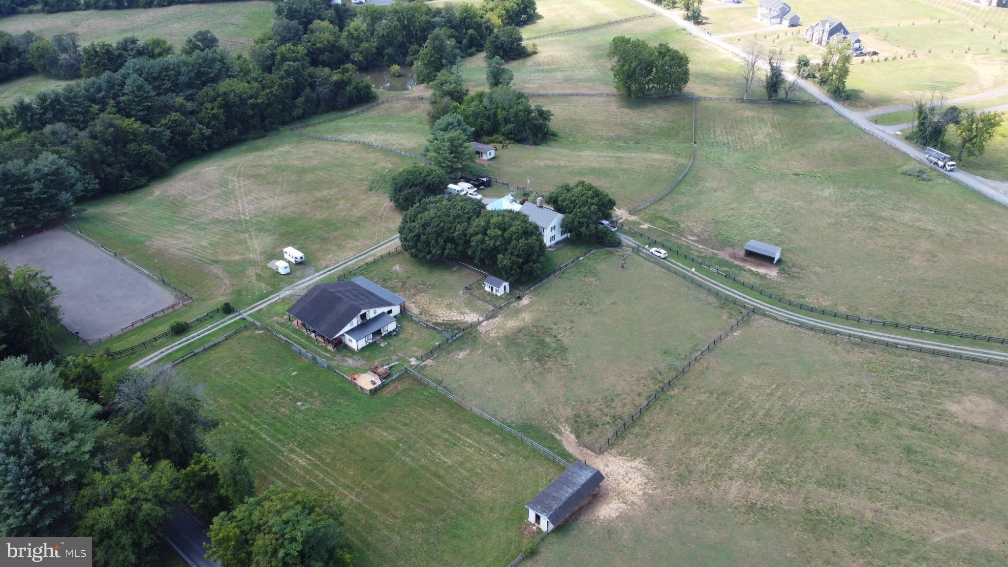 19255 Telegraph Springs Road Purcellville, VA 20132 - Photo 2 of 20 Aerial View of land and lush greenery.