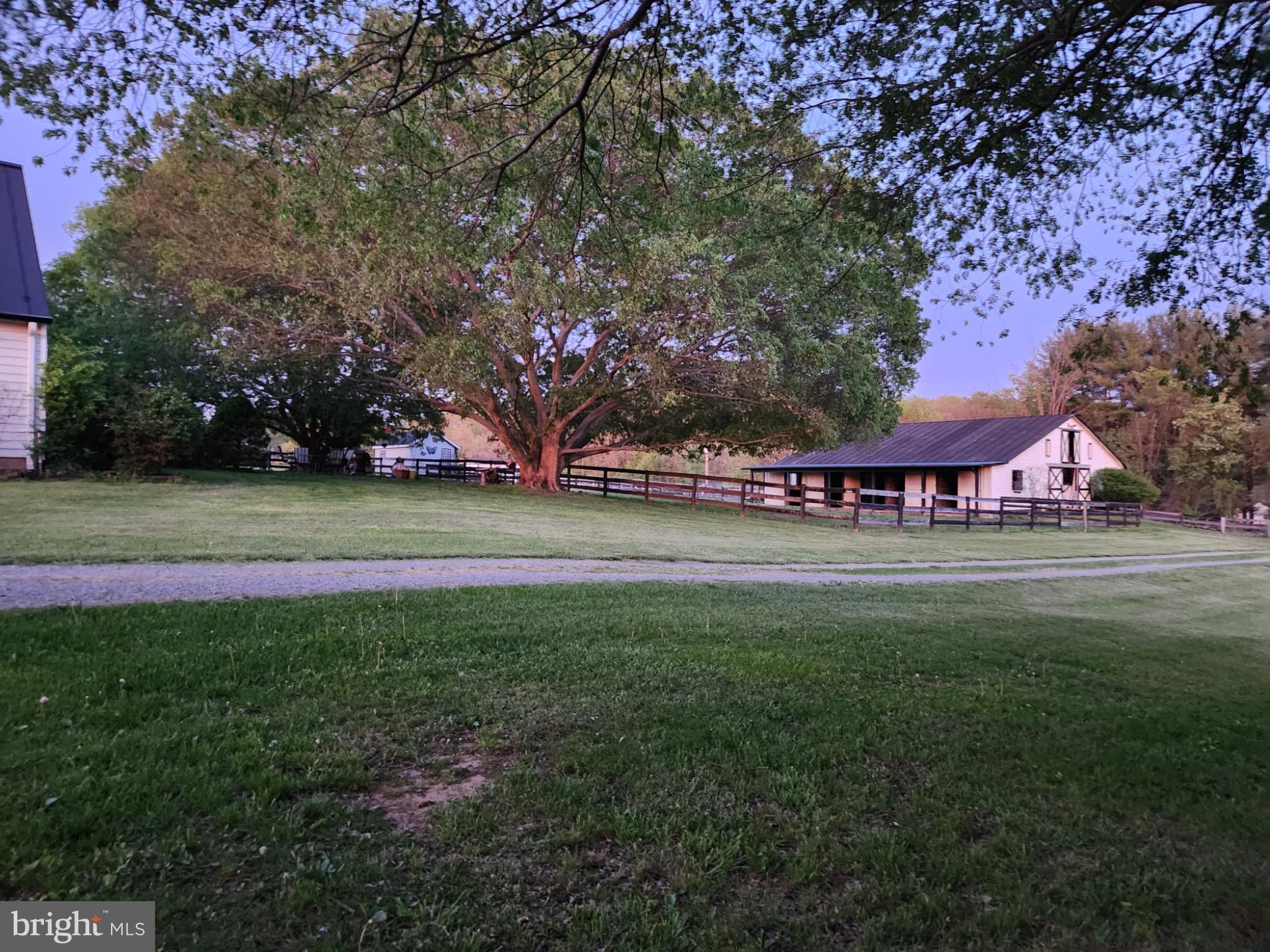 19255 Telegraph Springs Road Purcellville, VA 20132 - Photo 5 of 20 Serene countryside retreat at dusk.